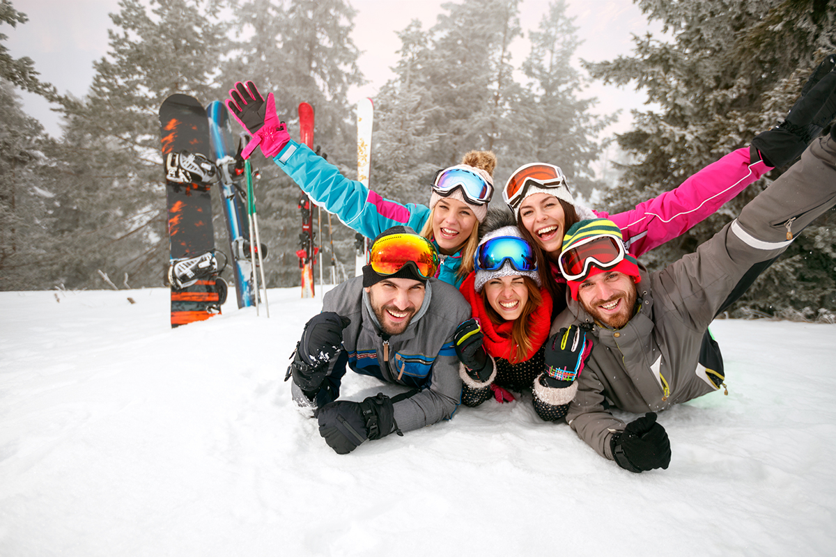 group of young people on ski hill